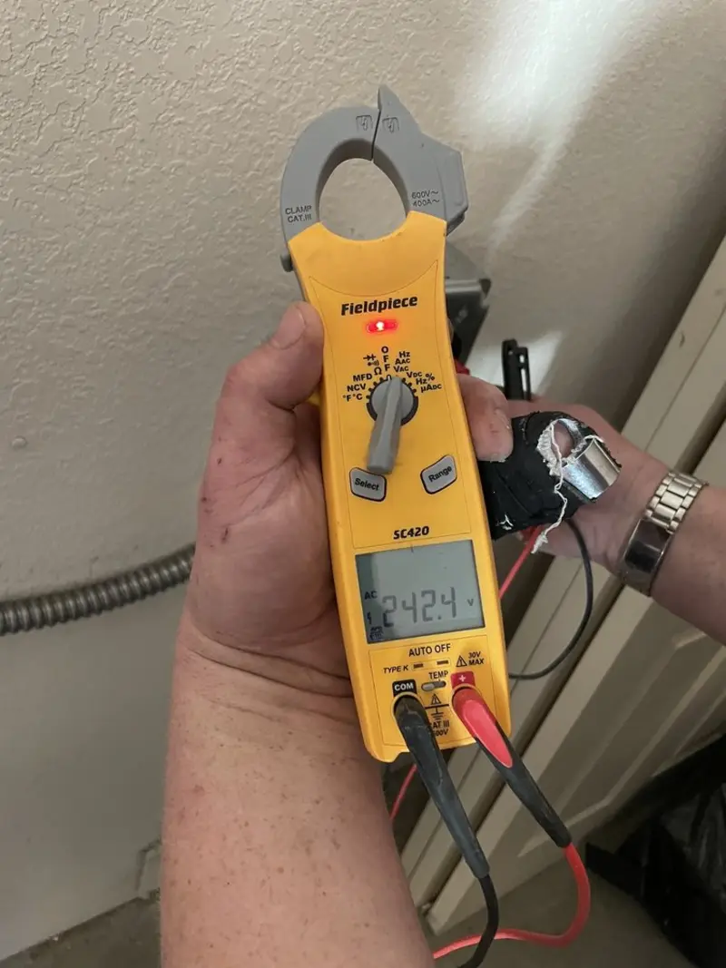 Voltage testing with clamp meter during Outlet Installation in Winthrop Town